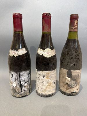 three bottles of wine sitting next to each other on a table