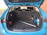 a trunk of a car with a suitcase in it