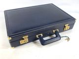 a blue briefcase sitting on top of a white table