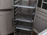 an image of a kitchen with a rack of food in it