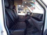 a picture of the inside of a van with black leather seats