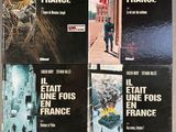 six books of french novels on a table in a room