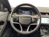 the interior of a car with a steering wheel and dashboard controls