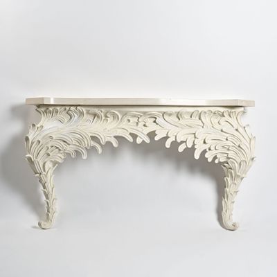 une photo d'une console blanche avec un plateau en marbre
