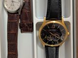 two watches and a watch in a box