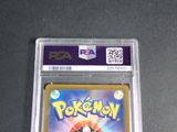 a close up of a pokemon card in a plastic case