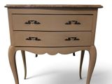 an image of a small chest of drawers with a marble top