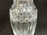 a glass vase that is sitting on a table