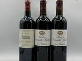 trois bouteilles de vin sont alignées sur une surface blanche