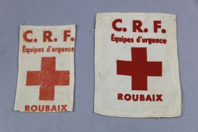 two pieces of cloth with a red cross and a red cross on them