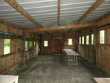a room with tables and benches inside of it