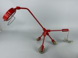 a red lamp that is sitting on top of a table