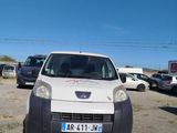 a small white van parked in a parking lot