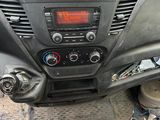 a dashboard of a car with a radio and a steering wheel
