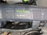 a black and green electric tool on a table
