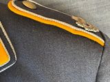a close up of a uniform on a person ' s lapel
