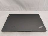 a laptop that is sitting on a white surface