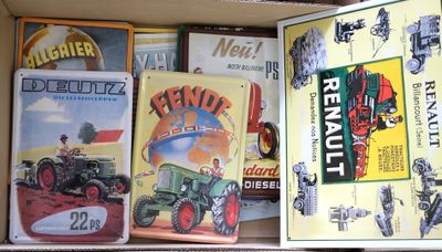 a box full of books with pictures of tractors on it