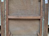 a picture of an old wooden frame with a picture on it