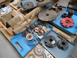 many different types of machinery on a pallet in a warehouse