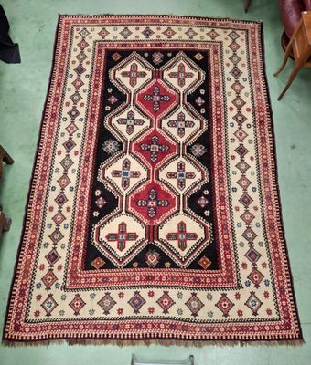 an oriental rug on the floor in a living room