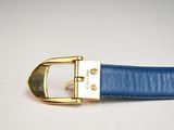 blue leather belt with a gold buckle on a white surface