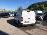 a white van that is parked in a parking lot
