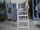 a ladder that is sitting in the middle of a room