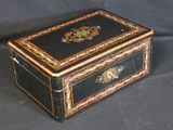 a black and gold box sitting on a black background