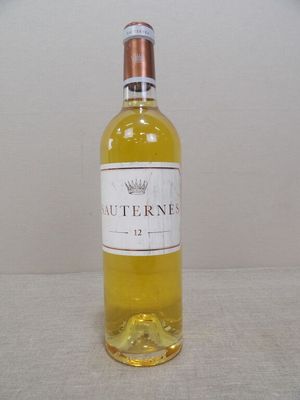 a bottle of wine that is sitting on a table