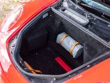 a trunk of a car with a gas can in it