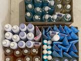 several boxes of bottled water are lined up on a table