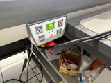 a machine that is sitting on a shelf in a room