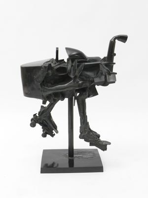 an image of a sculpture of a dog on a stand on a white background