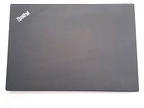 a laptop that is sitting on a white surface