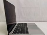 a laptop computer sitting on a table with a white background