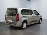 a silver van that is parked in a room