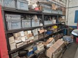 many boxes and bins on the shelves in the garage