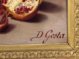a painting of pomegranates on display in a gold frame