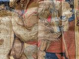 an image of a tapestry with a man riding a horse