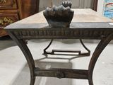 a small table with a flower on it in a room