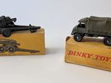 two toy trucks that are sitting on top of a box