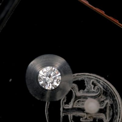 a diamond in the middle of a piece of glass