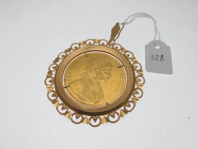 an image of a gold coin with a tag on it