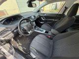 the interior of a small car with black seats and a steering wheel