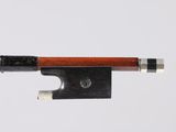 a close up of a violin bow on a white background