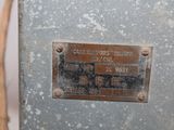 a metal plaque on the side of a machine