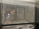 a picture of a window that has a broken glass on it