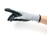 a person holding a pair of gloves in their hand