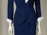 an image of a mannequin wearing a blue suit and white shirt